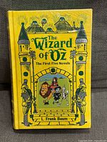 Front cover of yellow hardcover book in shrink wrap