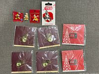 Overview of all ten pins laid out on fabric background