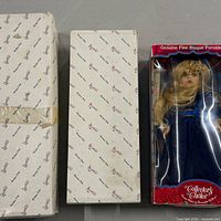 Three boxed dolls: two Duck House boxes and one Collector's Choice window box