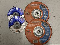Group view of all four grinding wheels showing brands, sizes, hubs