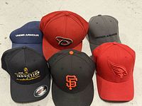 All six caps front view showing logos and colors