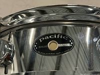 Close-up of Pacific badge with serial number 36765