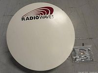 Front view of Radiowaves parabolic antenna and mounting hardware bag