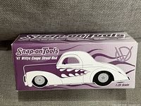 Closed box showing Snap-on Tools branding and car illustration