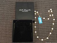 Necklace with box and pouch