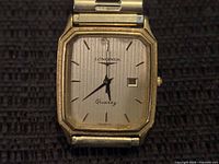 Front view of Longines watch dial and case