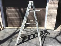 Full view of folded aluminum A-frame ladder