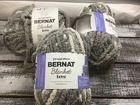 Three skeins Bernat Blanket Extra yarn full view