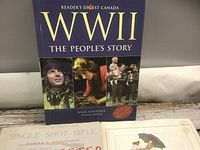 Front cover of WWII book with partial view of other two books