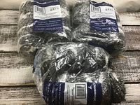 Three sealed packages of Cambridge Fibres variegated yarn