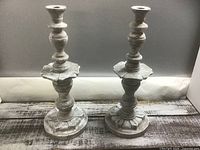 Front view of both chalk painted candlesticks