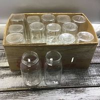 Box containing 14 clear glass canning jars