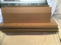 Stack of flat packed cardboard boxes