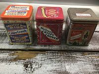 Front view of three Crispy Crunch tins