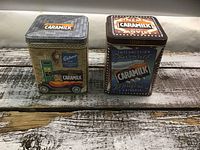 Front and top view of both Caramilk tins
