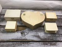 Five unfinished wood boxes displayed together
