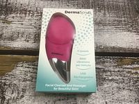 Front of boxed DermaScrub facial cleanser and massager