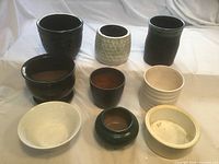 Top view of nine ceramic flower pots arranged in rows