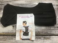 Full view of posture aid brace with instruction sheet