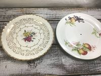Two 10-inch drilled plates side by side
