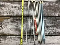 All 14 knitting needles alongside measuring tape