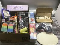 Entire lot in two boxes showing paint kit, foam brushes, chalk, wood items