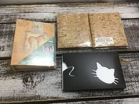 All four albums laid out on table
