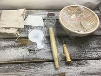 All items laid out including basket, tools, liners