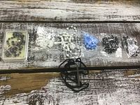 Overview of all rosaries and cross necklace laid out