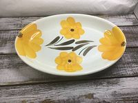 Top view of oval platter showing yellow floral design