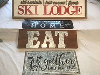 All four signs laid out on table