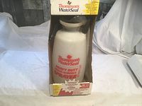 Front view of boxed Thompson's WaterSeal sprayer