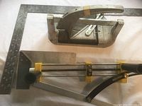 Overall view showing framing square, mitre trimmer, tile cutter and try square