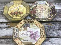 All three octagonal plaques displayed on wood surface