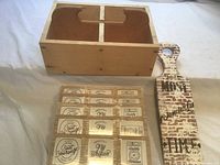 Overall view: wooden caddy, stack of five plaques, paddle sign front