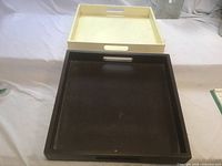 Top view showing both square trays, white stacked on black