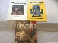 All three woodworking books side by side