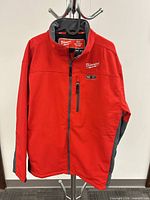 Front view of Milwaukee heated jacket showing color, chest pocket, zipper, logo