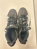 Top view of both cleats showing uppers, laces, overall wear