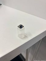 Full view of onyx ring on clear stand