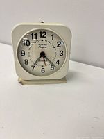 Front view showing dial, branding, numerals, hands