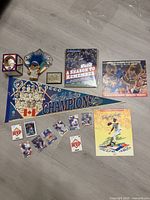 Lot overview showing pennant, troll doll, booklets, patch, loose cards