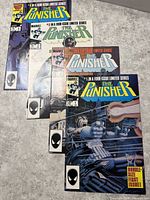 Four The Punisher limited series comics laid out overlapping