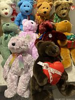 All ten Ty Beanie Bears grouped together showing tags and ribbons