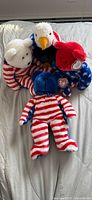 Four Ty patriotic plush toys grouped