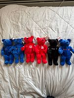 Front view of six Wayne Gretzky Salvino’s Bammers bears in assorted colours