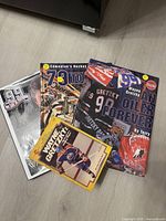 Four Wayne Gretzky books spread on floor