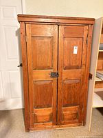 Full front view of wooden cupboard