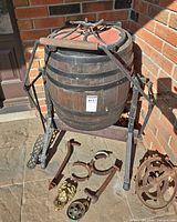 full view of barrel churn on stand with loose hardware pieces
