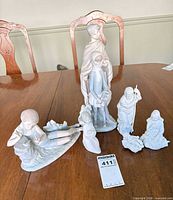 Group shot of all six figurines on table